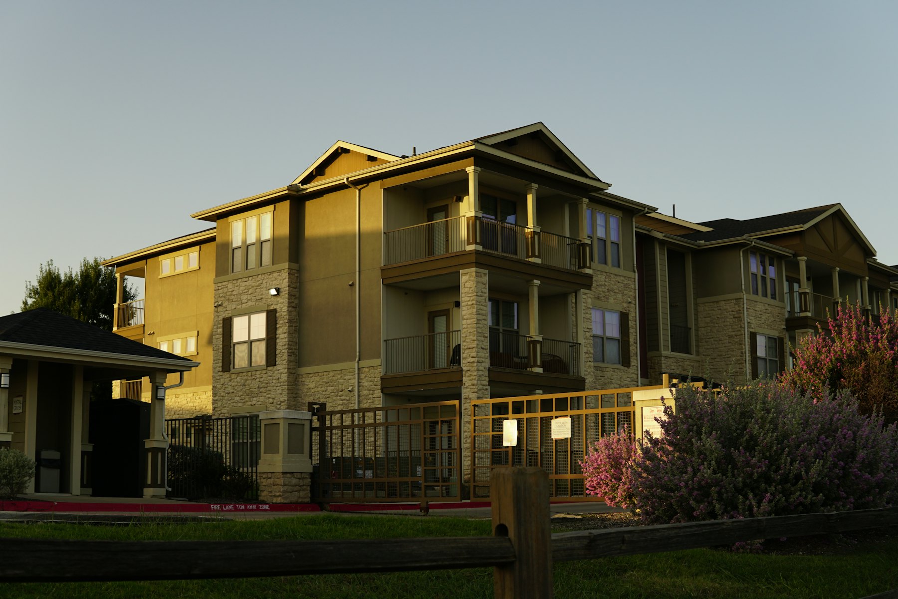 Garden-style apartment buildings at golden hour